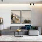 Amalfi Coastline Canvas Art – set of 2 vertical Amalfi coastline landscape prints in a gold floating frame in a living room with charcoal accents