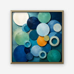 Blue Textured Circles Canvas Art – square blue and teal geometric abstract print in a gold floating frame on a white background