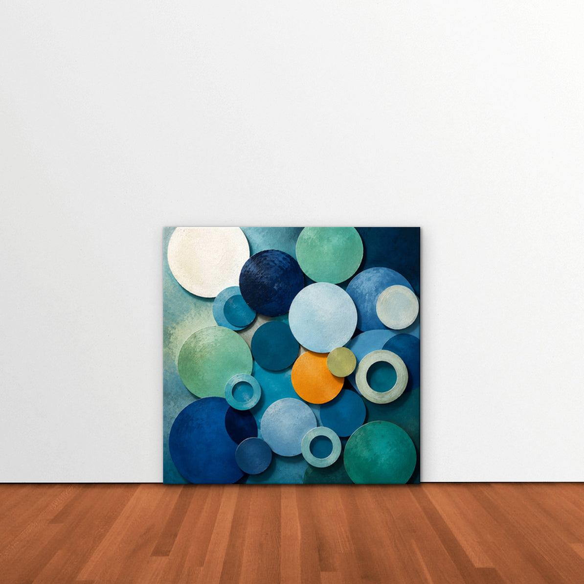 Blue Textured Circles Canvas Art – square blue and teal geometric abstract print as a gallery-wrapped canvas leaning against a white wall