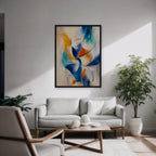 Cobalt and Saffron Swirl Canvas Art – vertical cobalt and orange abstract print in a black floating frame in a modern living room