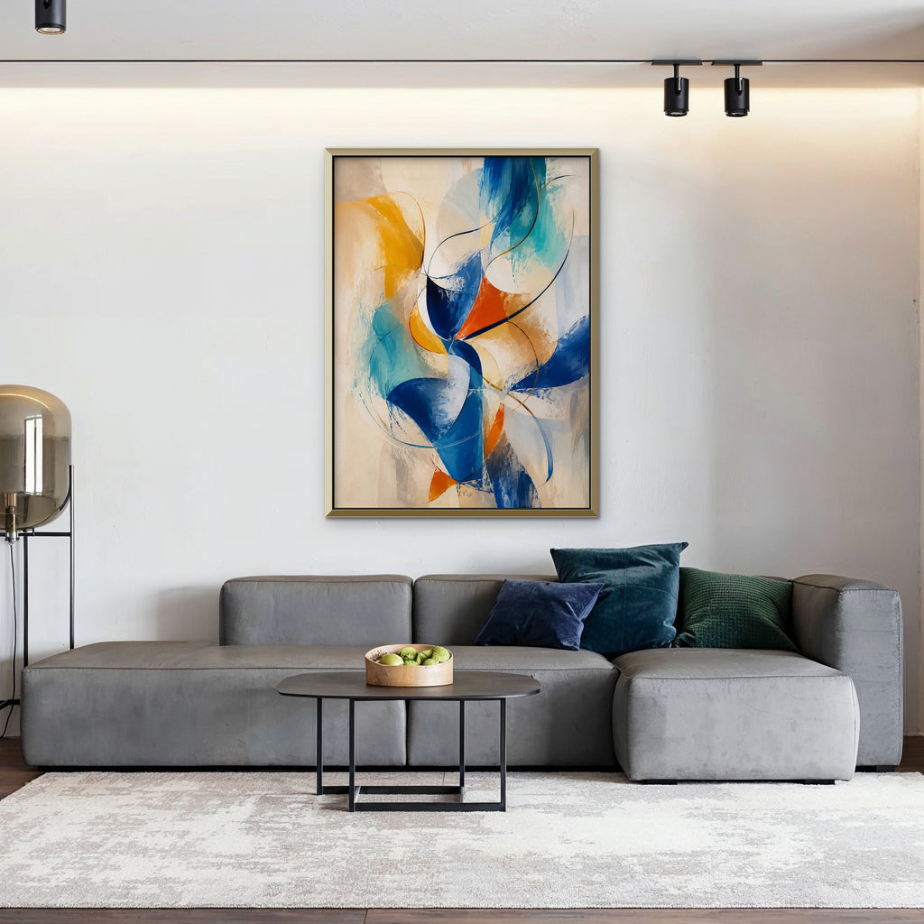 Cobalt and Saffron Swirl Canvas Art – vertical cobalt and orange abstract print in a gold floating frame in a living room with charcoal accents