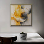 Golden Orbit Canvas Art – square golden yellow abstract print in a gold floating frame in a dining room