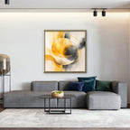 Golden Orbit Canvas Art – square golden yellow abstract print in a gold floating frame in a living room with charcoal accents