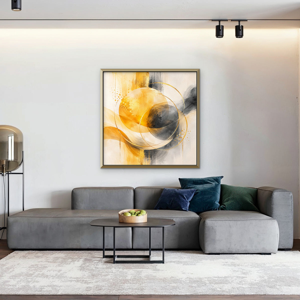 Golden Orbit Canvas Art – square golden yellow abstract print in a gold floating frame in a living room with charcoal accents