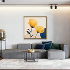 Golden Poppies Canvas Art – square golden poppy floral print in a gold floating frame in a living room with charcoal accents