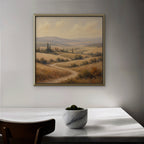 Golden Tuscan Fields Canvas Art – square golden countryside landscape print in a gold floating frame in a dining room