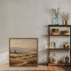 Golden Tuscan Fields Canvas Art – square golden countryside landscape print in an oak floating frame styled on a shelf