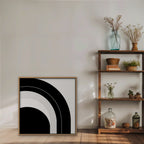 Monochrome Arc Canvas Art – square black and white geometric abstract print in an oak floating frame styled on a shelf