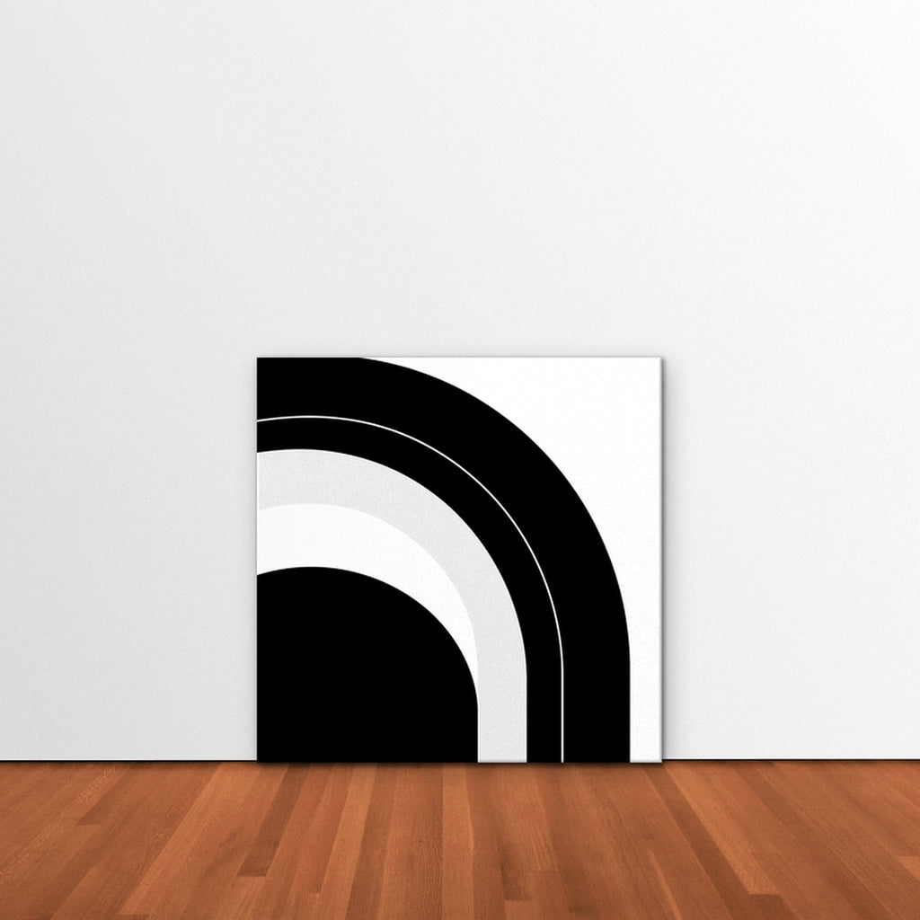 Monochrome Arc Canvas Art – square black and white geometric abstract print as a gallery-wrapped canvas leaning against a white wall