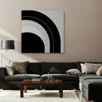 Monochrome Arc Canvas Art – square black and white geometric abstract print as a gallery-wrapped canvas in a taupe living room