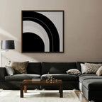 Monochrome Arc Canvas Art – square black and white geometric abstract print in a walnut floating frame in a taupe living room