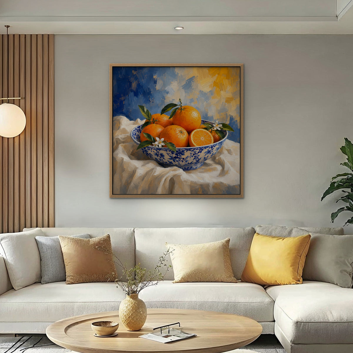 Oranges in Blue Porcelain Canvas Art – square orange and cobalt still life print in an oak floating frame in a bright living room