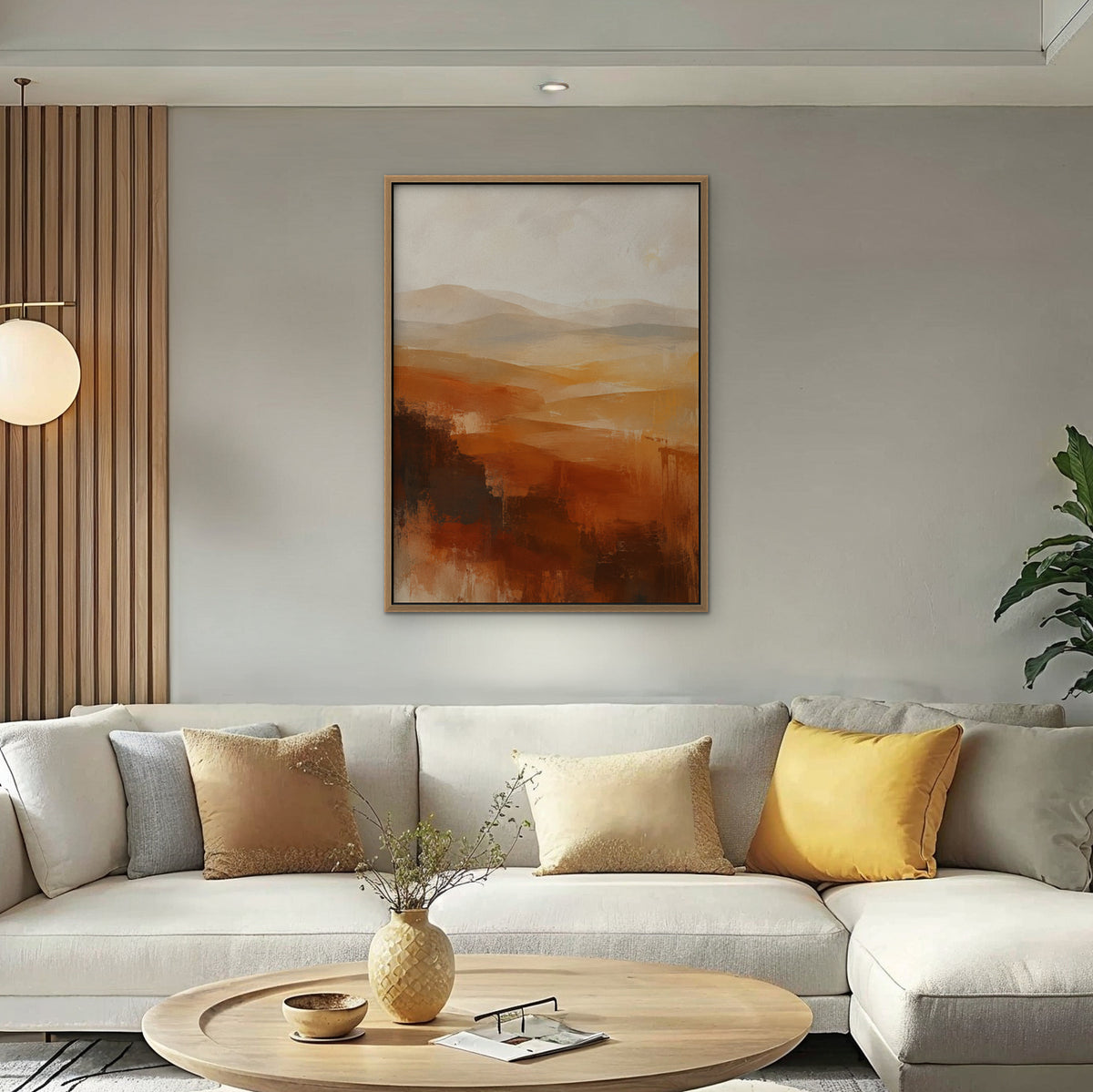 Rust Hills at Dusk Canvas Art – vertical rust and ochre abstract landscape print in an oak floating frame in a bright living room