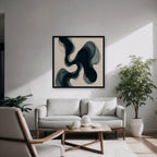 Smoky Teal Drift Canvas Art – square navy and teal abstract print in a black floating frame in a modern living room