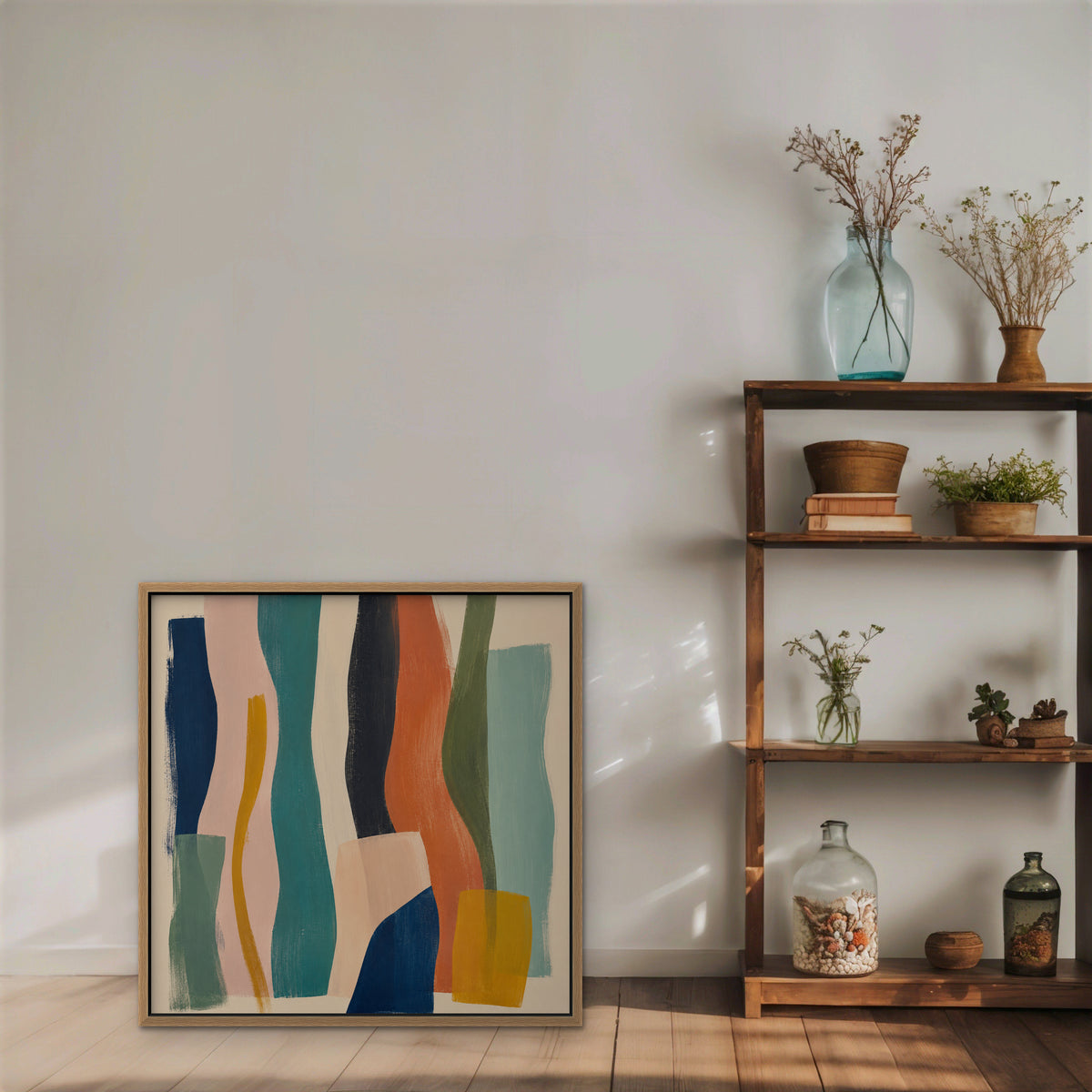 Teal and Coral Ribbons Canvas Art – square teal and coral abstract print in an oak floating frame styled on a shelf